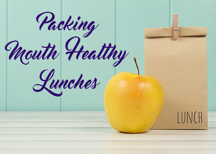 Dickinson dentist, Dr. Agee Kunjumon at Touchstone Dentistry, suggests what foods to add to your child’s school lunch to nourish their oral and overall health.